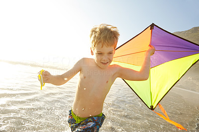 Enjoying his new kite at the beach