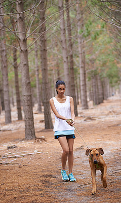 Walking through the forest with her loyal companion