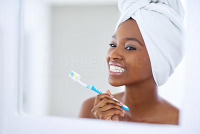 Tending to her pearly whites