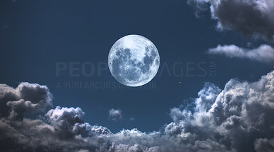 The Moon surrounded by clouds