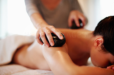 Warming her way to wellness with hot stone therapy