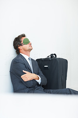 Business man with sleep mask