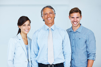 Business team of three smiling