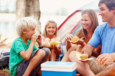 Family having breakfast while camping
