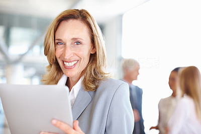Business woman using electronic tablet