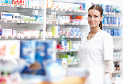 Smiling pharmacist at store
