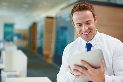 Happy business man using digital PC