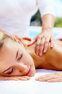 Lady enjoying a professional back and shoulder massage