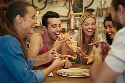 Grabbing a slice of pizza with good friends