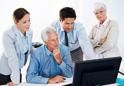 Successful group of businesspeople working on computer
