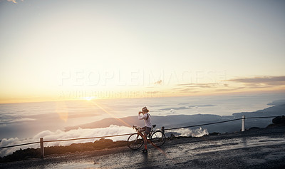 Watching the sunrise as she cycles