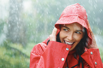 Woman smiling while out in rain