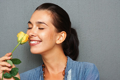 Woman smelling fragrant flower