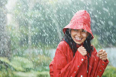Woman wearing red rain coat in the rain