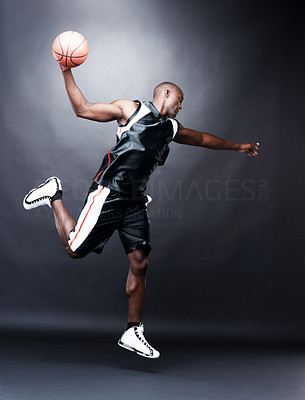 Young black guy playing basketball