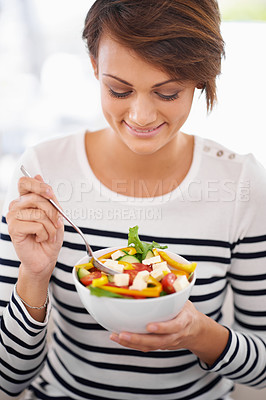Smiling at her salad