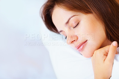 Closeup of a pretty female fast asleep in bed