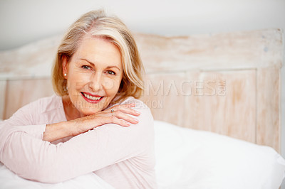 Happy mature woman giving you a cute smile