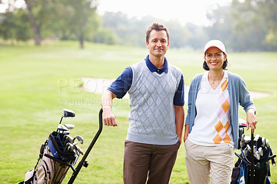Couple smiling on golf course