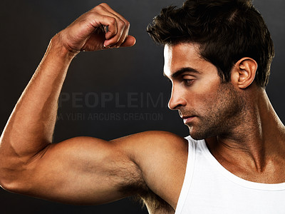Young man flexing his biceps