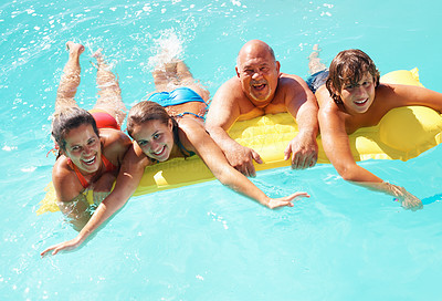 Happy family having fun in water