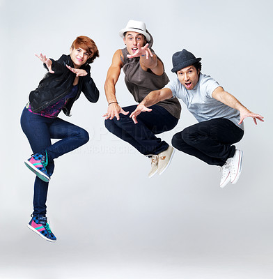 Jumping up krump style dancer on grey background