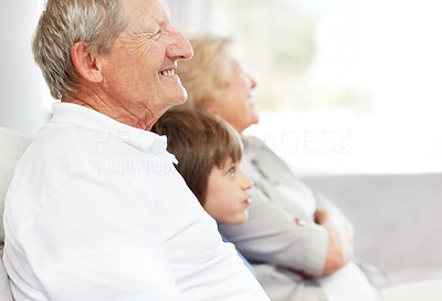 Old man looking away with his wife and grandson