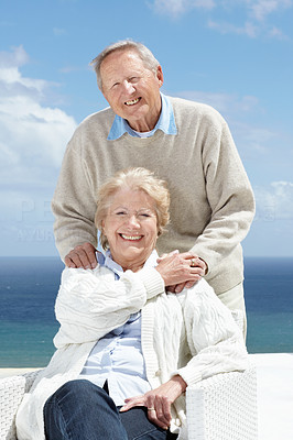 Smiling elderly couple enjoying themselves together