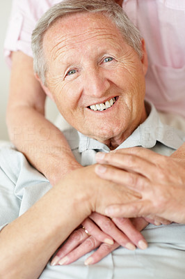 Handsome old man smiling with his wife