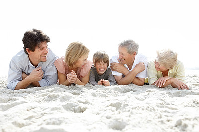 Sweet family having fun together on the beach