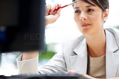 Young business woman thinking about a problem