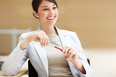 Smiling young business woman thinking about something