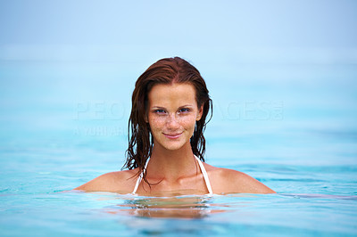 Relaxed young woman in water