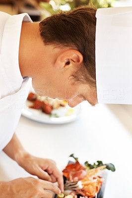 Chef doing finishing touch on a exotic dish