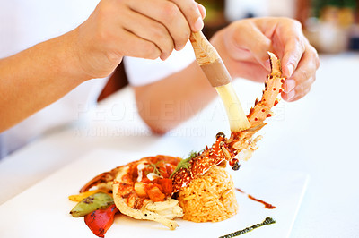 Chef decorating a dish in kitchen
