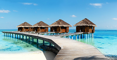Wooden beach villas on tropical waters