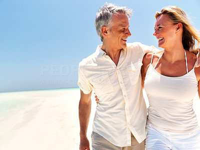 Lovely mature couple having good time at the beach