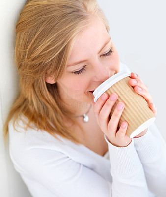Young lady drinking coffee