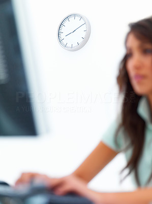 Blur view of a young business woman working on computer isolated on white background