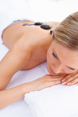Closeup of a female getting a stone massage therapy