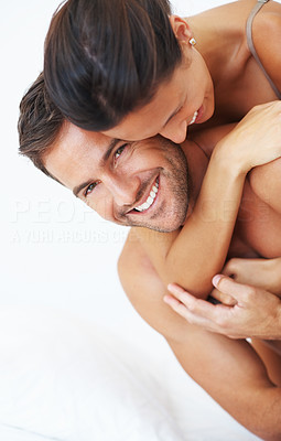Woman embracing man from behind
