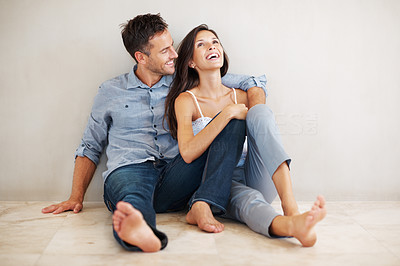 Cute couple relaxing on floor