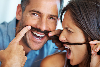 Couple teasing with fake mustache