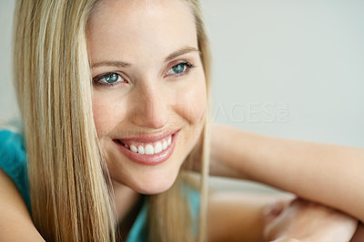 Closeup of an attractive young woman lost in thoughts