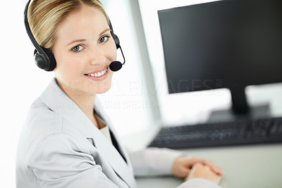 Beautiful business customer service woman - smiling in an office