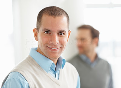 Happy young man with a person in blurred background