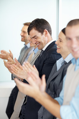 Business team clapping a good presentation in office