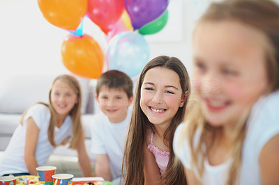 Cute young friends having fun at a birthday party
