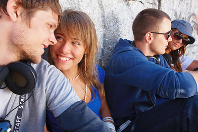 Smiling romantic young couples sitting together