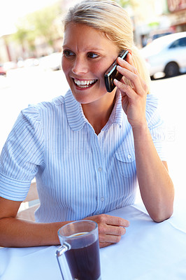 Happy young lady using a mobile phone